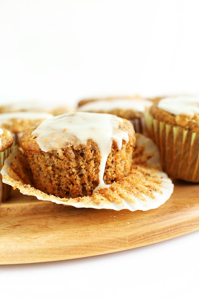 Parchment paper liner pulled down to reveal the texture of our Vegan Meyer Lemon Muffins