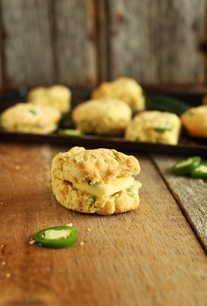 Close up shot of a Cheddar Jalapeno Biscuit stuffed with a square of vegan butter in it