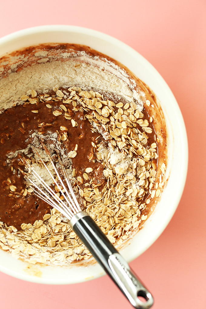 Whisking together wet and dry ingredients for gluten-free vegan Chocolate PB Banana Snack Bread