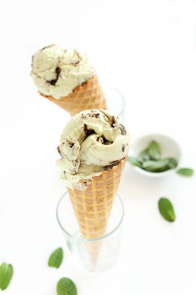 Scoops of Creamy Vegan Mint Brownie Ice Cream in waffle cones