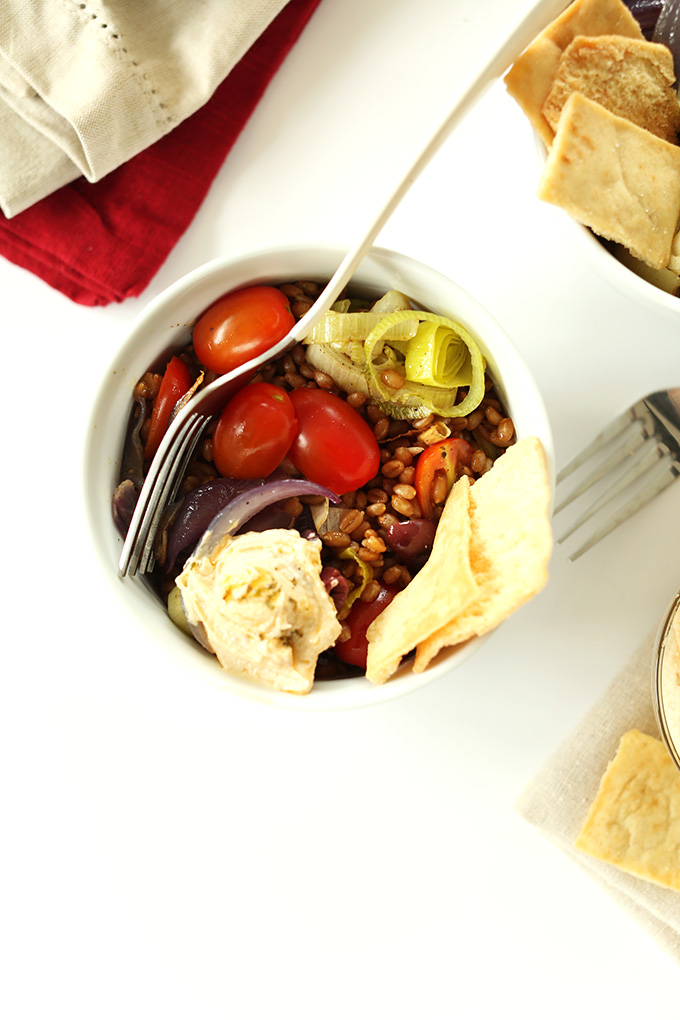 Top down shot of a Mediterranean Wheat Berry Salad Bowl made with roasted veggies