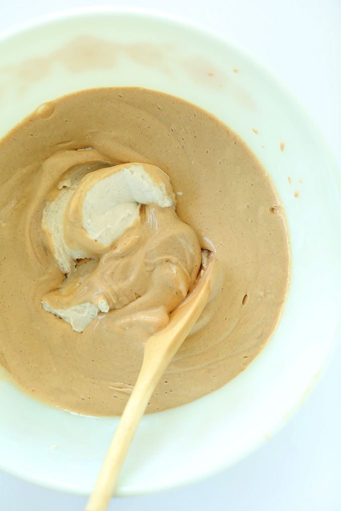 Using a wooden spoon to stir Peanut Butter Mousse Pie Filling