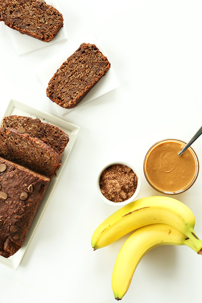 Slices and loaf of Vegan Chocolate Banana Peanut Butter Snack Bread