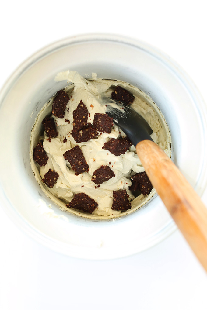 Vegan Mint Ice Cream with chunks of brownie pieces in an ice cream maker