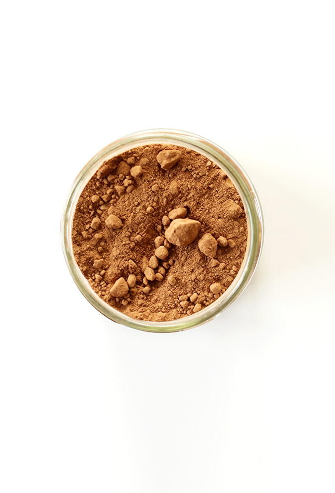 Jar of cacao powder for making homemade chocolate granola bars