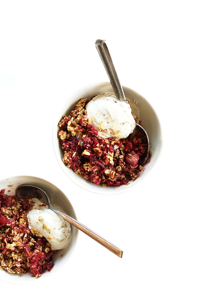 Bowls of Raspberry Rhubarb Crisp with scoops of vegan ice cream