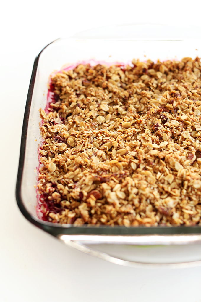Glass baking dish filled with a batch of our gluten-free vegan Raspberry Rhubarb Crisp