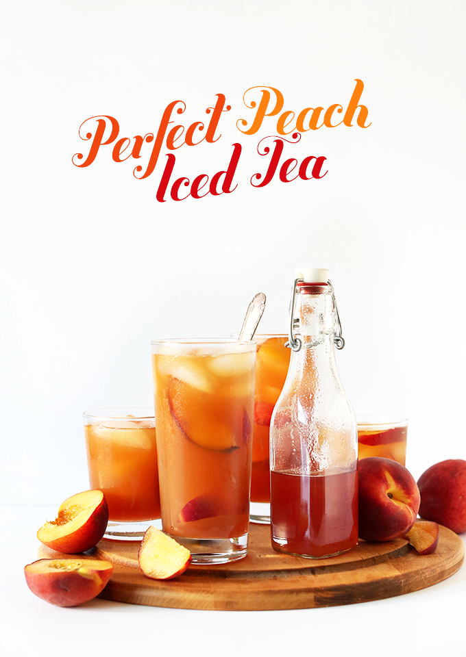 Cutting board with fresh peaches, simple syrup, and glasses of Peach Iced Tea
