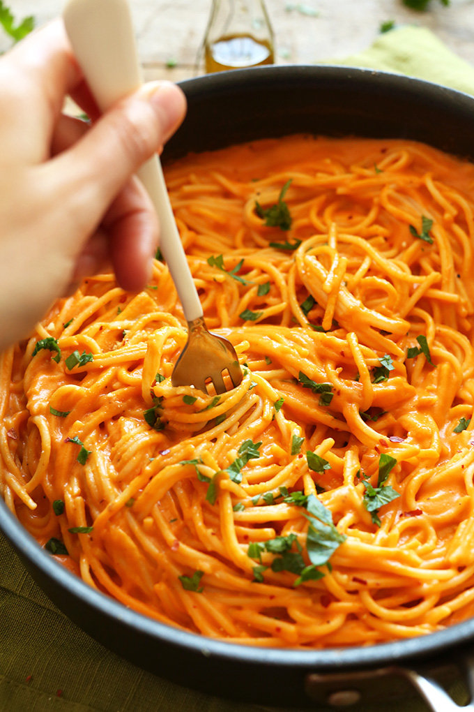 Using a fork to swirl around Vegan GF Roasted Red Pepper Pasta