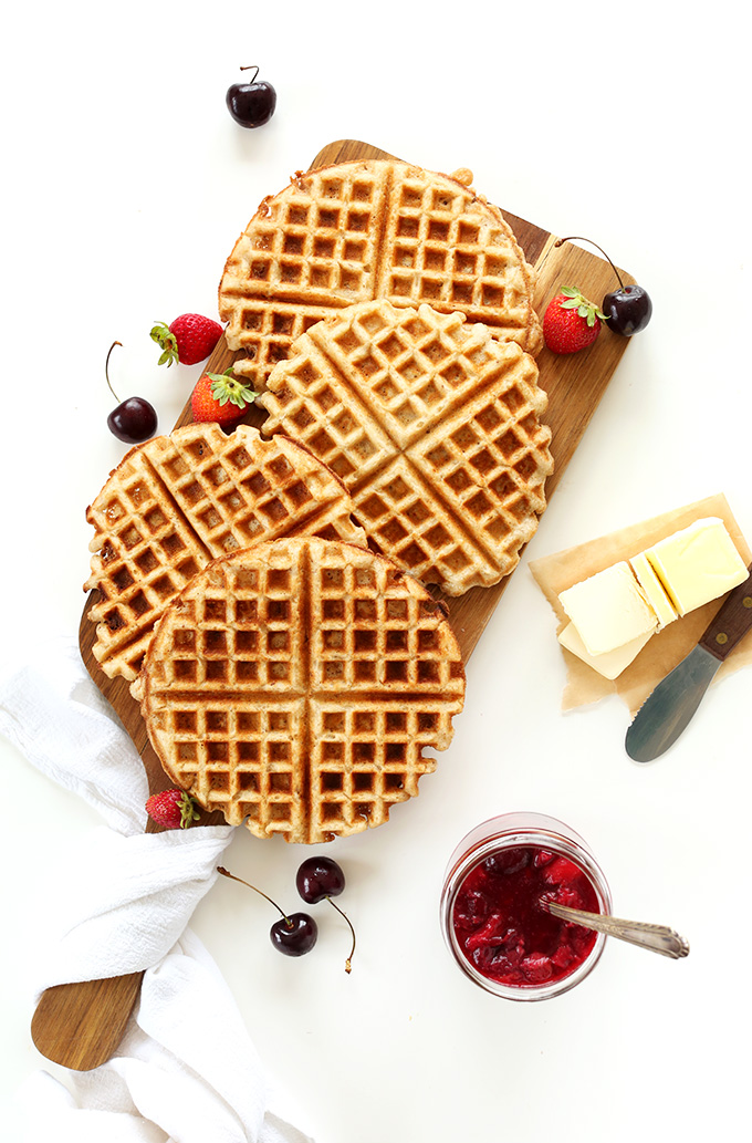 Freshly made Vegan Gluten-Free Waffles with vegan butter and fruit compote