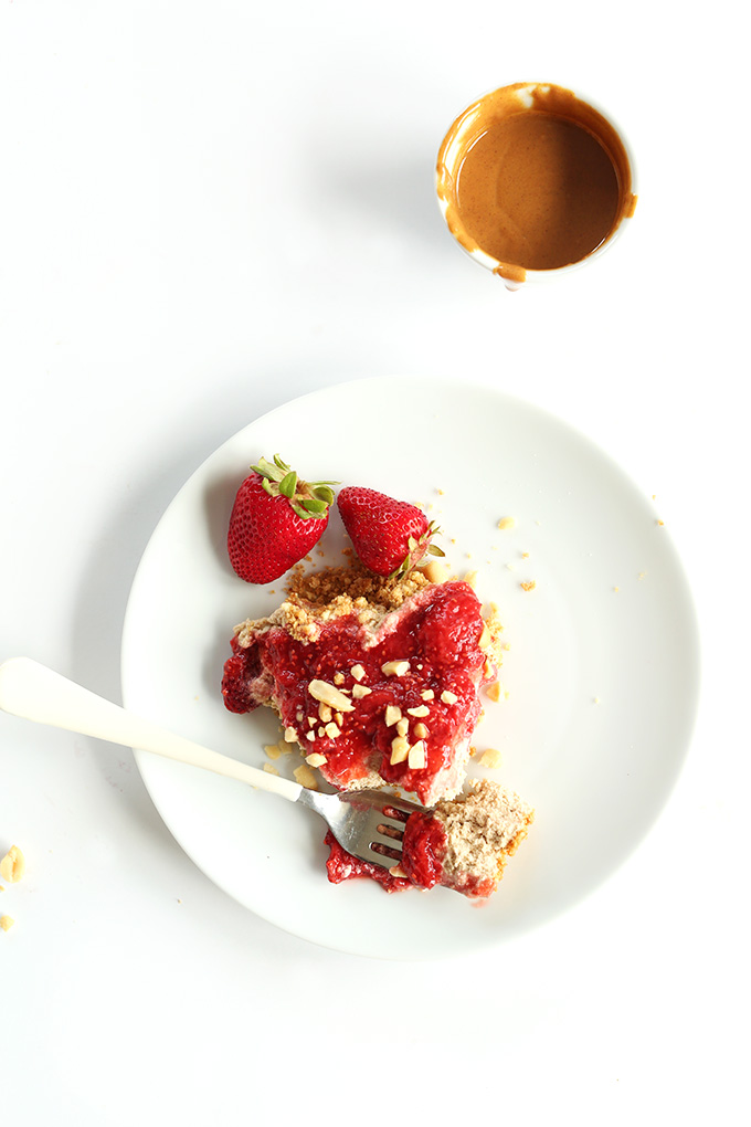 Slice of our amazing Vegan PB & J Pie recipe with fresh strawberries