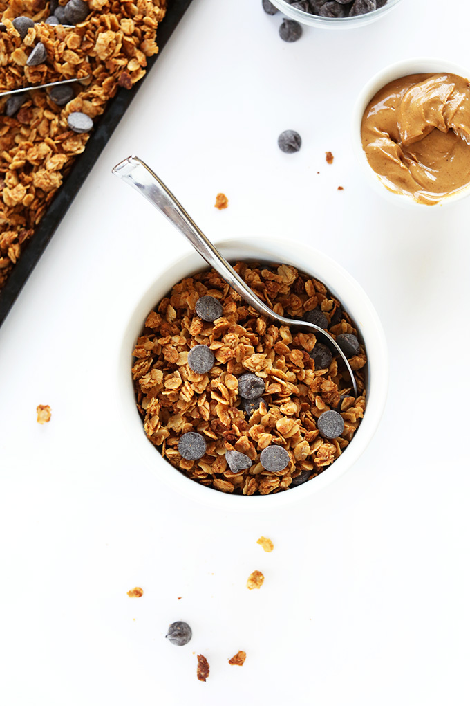 Bowl and tray of delicious Peanut Butter Chocolate Chip Granola