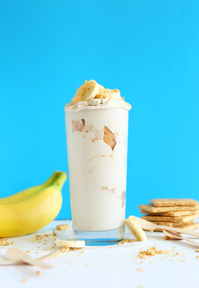 Glass jar of our Mega Creamy Banana Cream Pie Blizzard topped with fresh banana