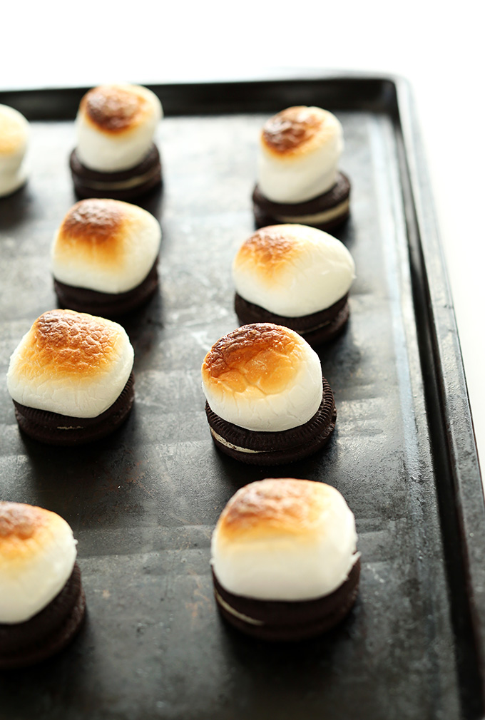 Baking sheet with freshly toasted marshmallows on top of oreos