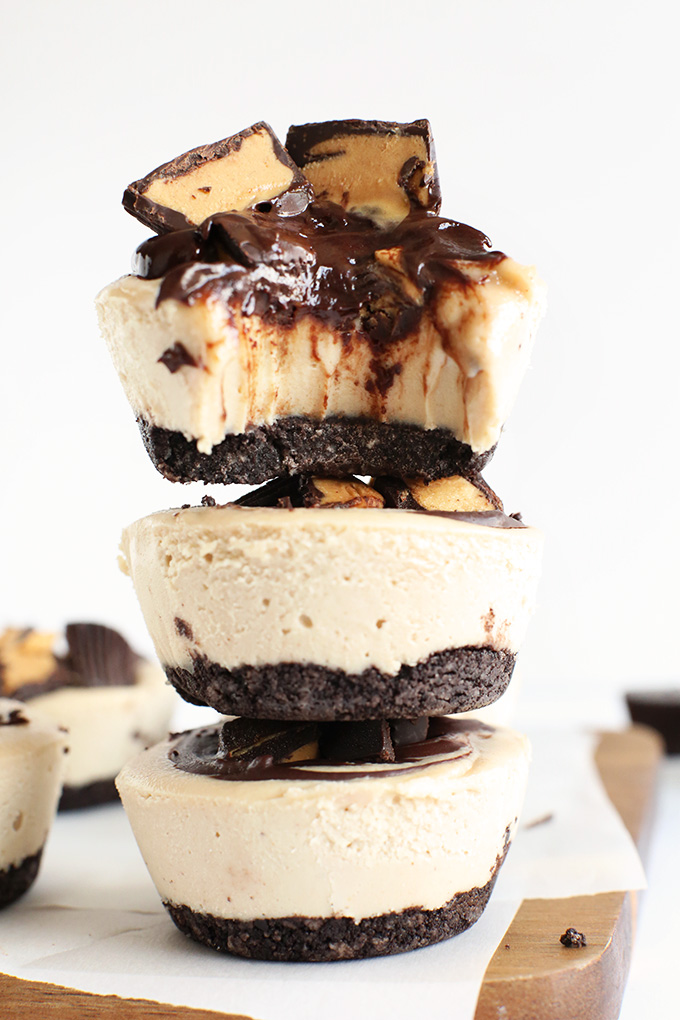 Stack of Vegan Peanut Butter Cup Cheesecakes with the top one partially eaten