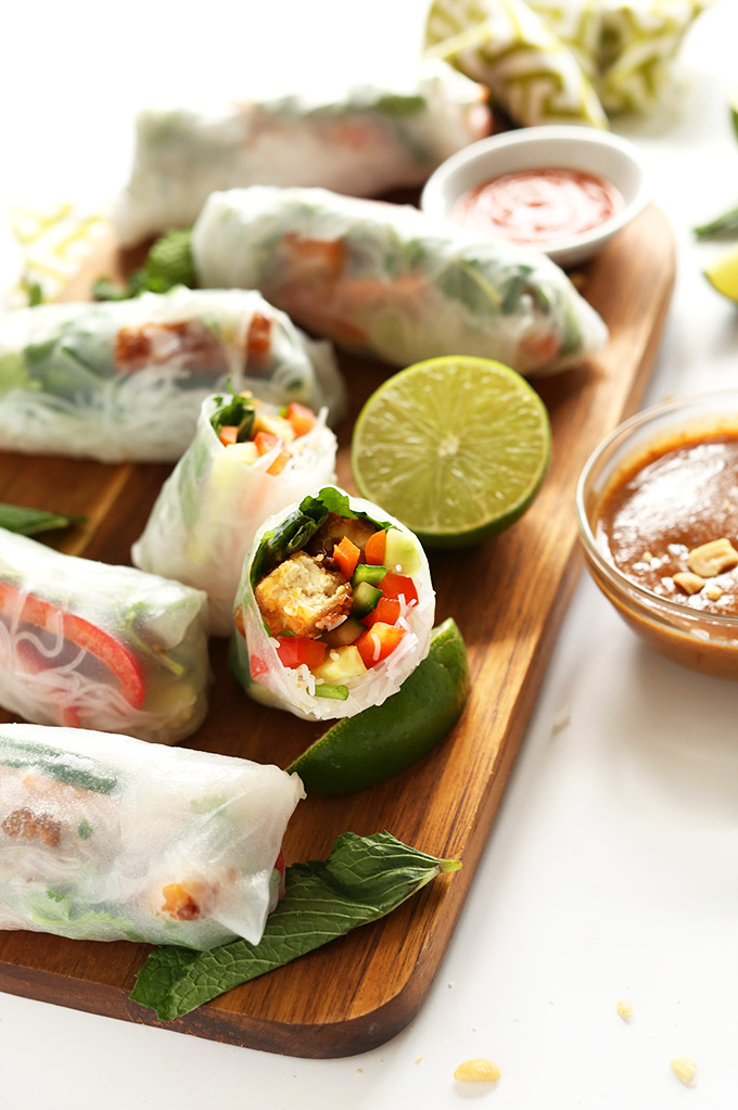 Cutting board with fresh Vegan Vietnamese Spring Rolls with Crispy Tofu