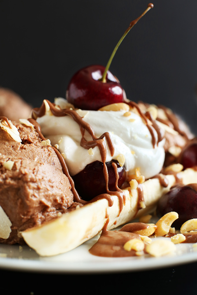 Vegan Banana Split with chocolate ice cream, cherries, and a nut butter drizzle