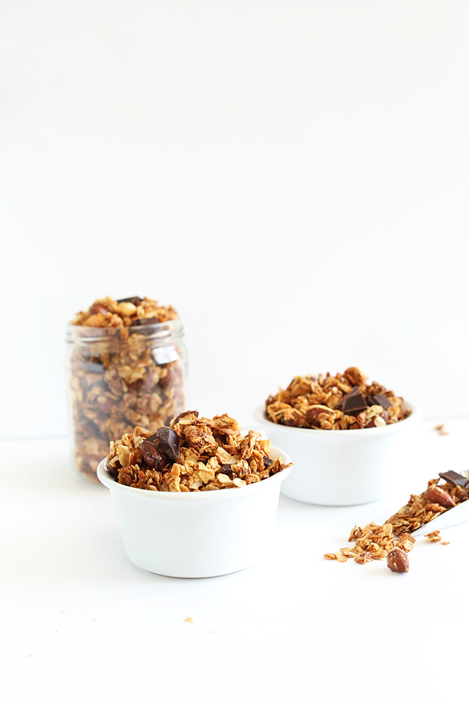 Jar and bowls loaded with our Almond Joy Granola recipe