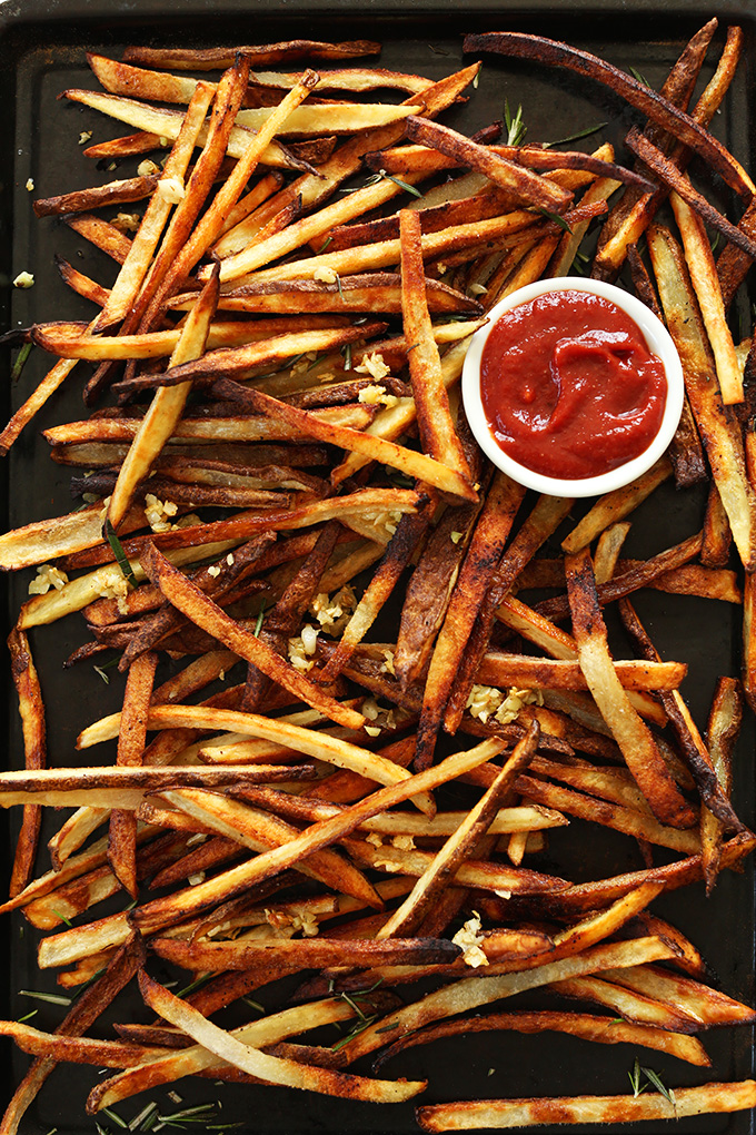 A batch of our Oven Baked Matchstick Fries with garlic and ketchup