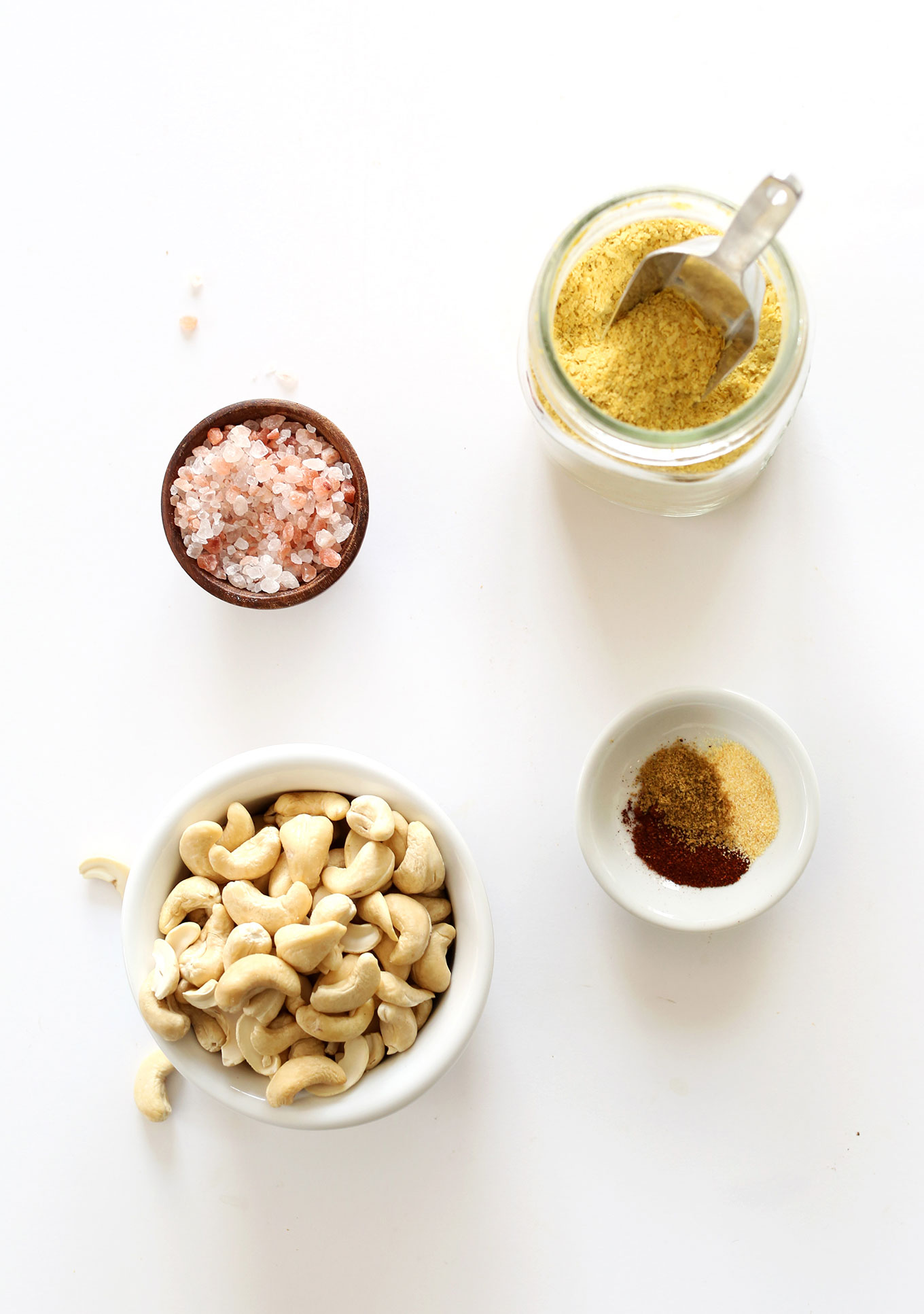 Cashews, salt, nutritional yeast, and spices for making Easy Vegan Mexican Cheese
