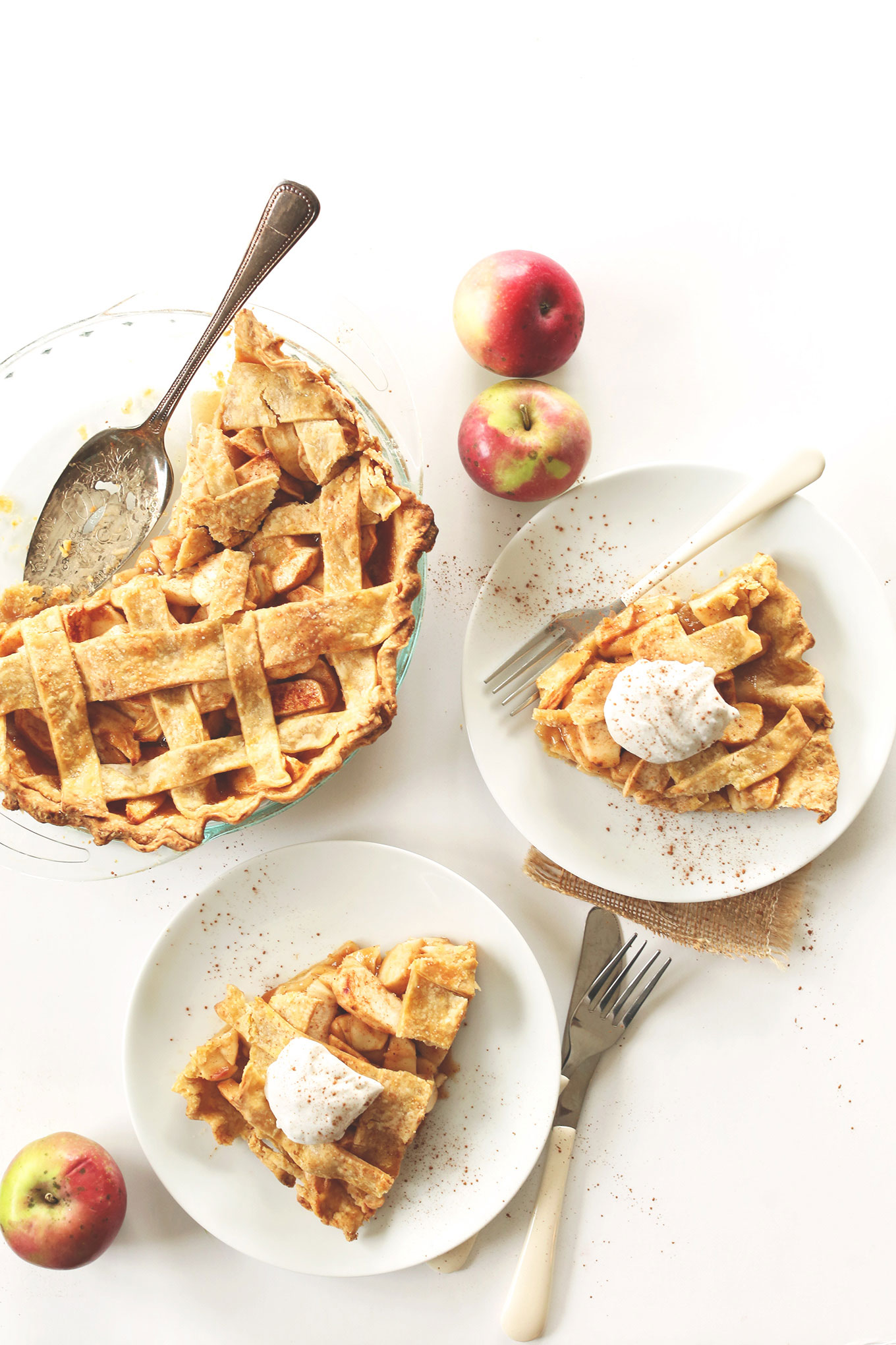 Slices of vegan Pumpkin Spiced Apple Pie with a lattice topping