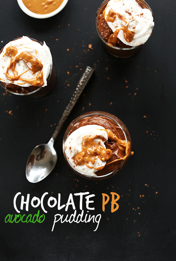 Jars of thick and creamy Chocolate Avocado Pudding topped with coconut whip and peanut butter
