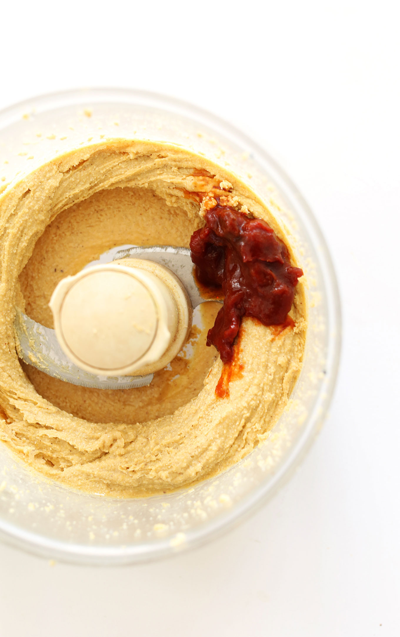Chipotle pepper added to a food processor with other Mexican Spreadable Cheese ingredients