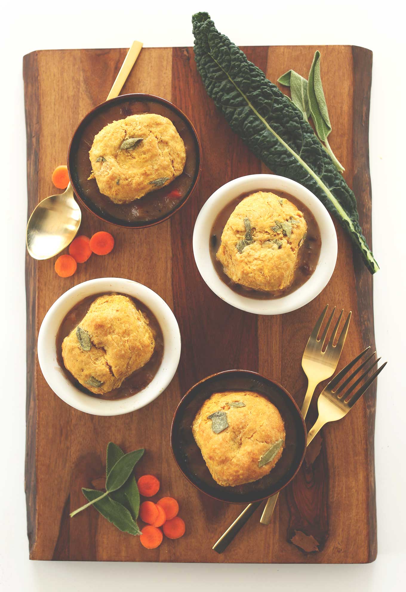 Small bowls of our Vegan Fall Pot Pies topped with Pumpkin Sage Biscuits