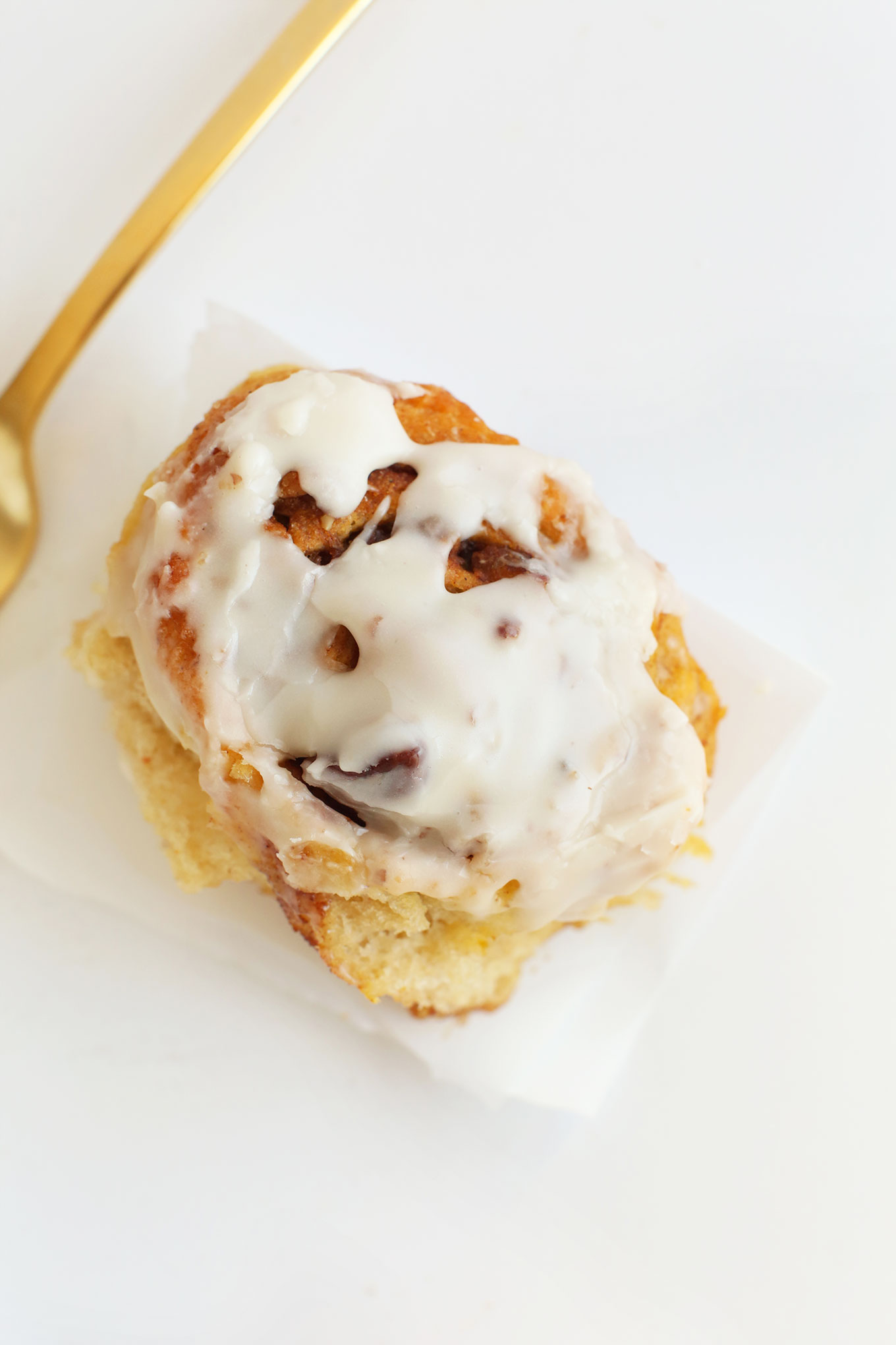 Overhead shot of a delicious and simple homemade Pumpkin Cinnamon Roll with icing