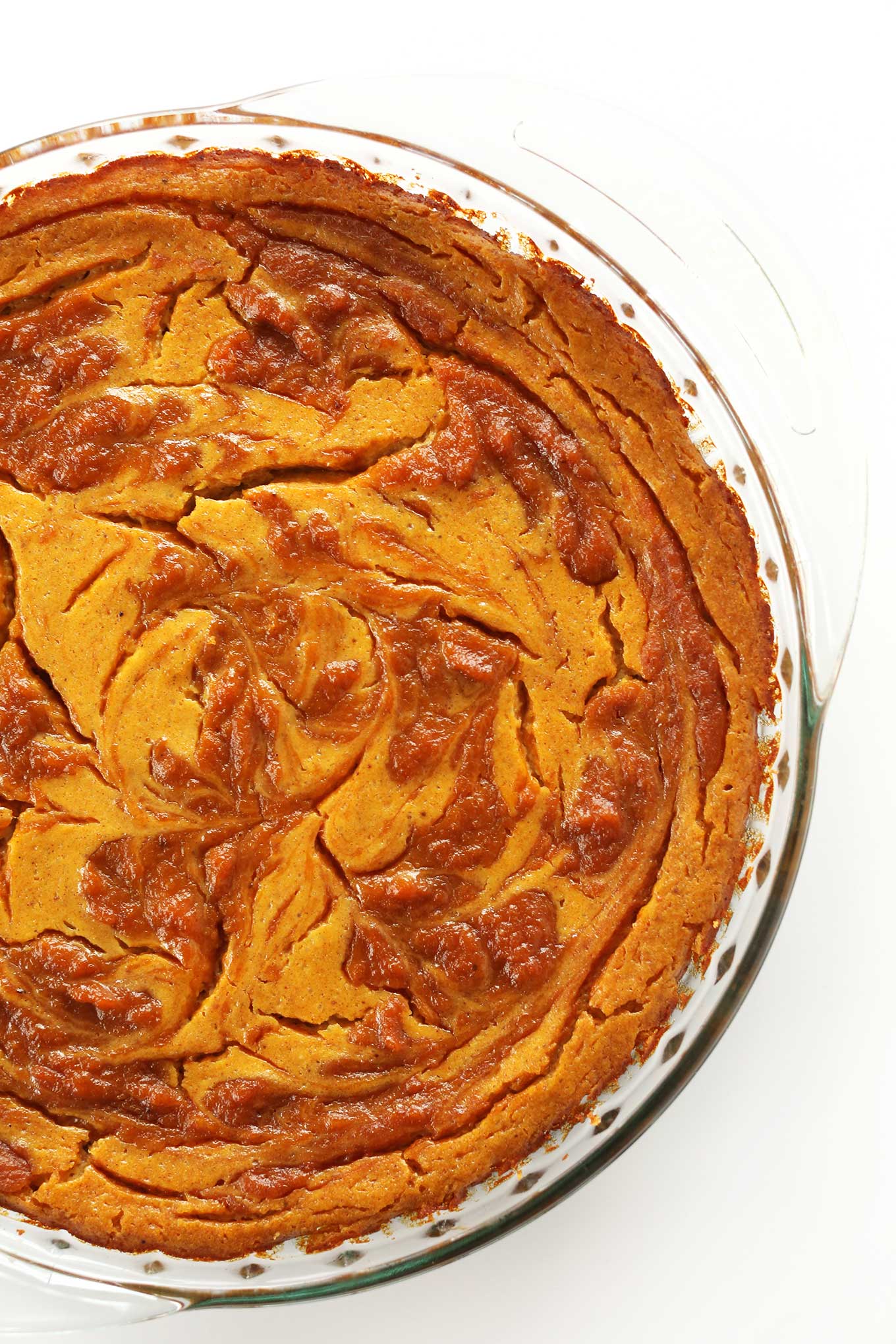 Pie pan filled with our Vegan Pumpkin Swirl Cheesecake recipe