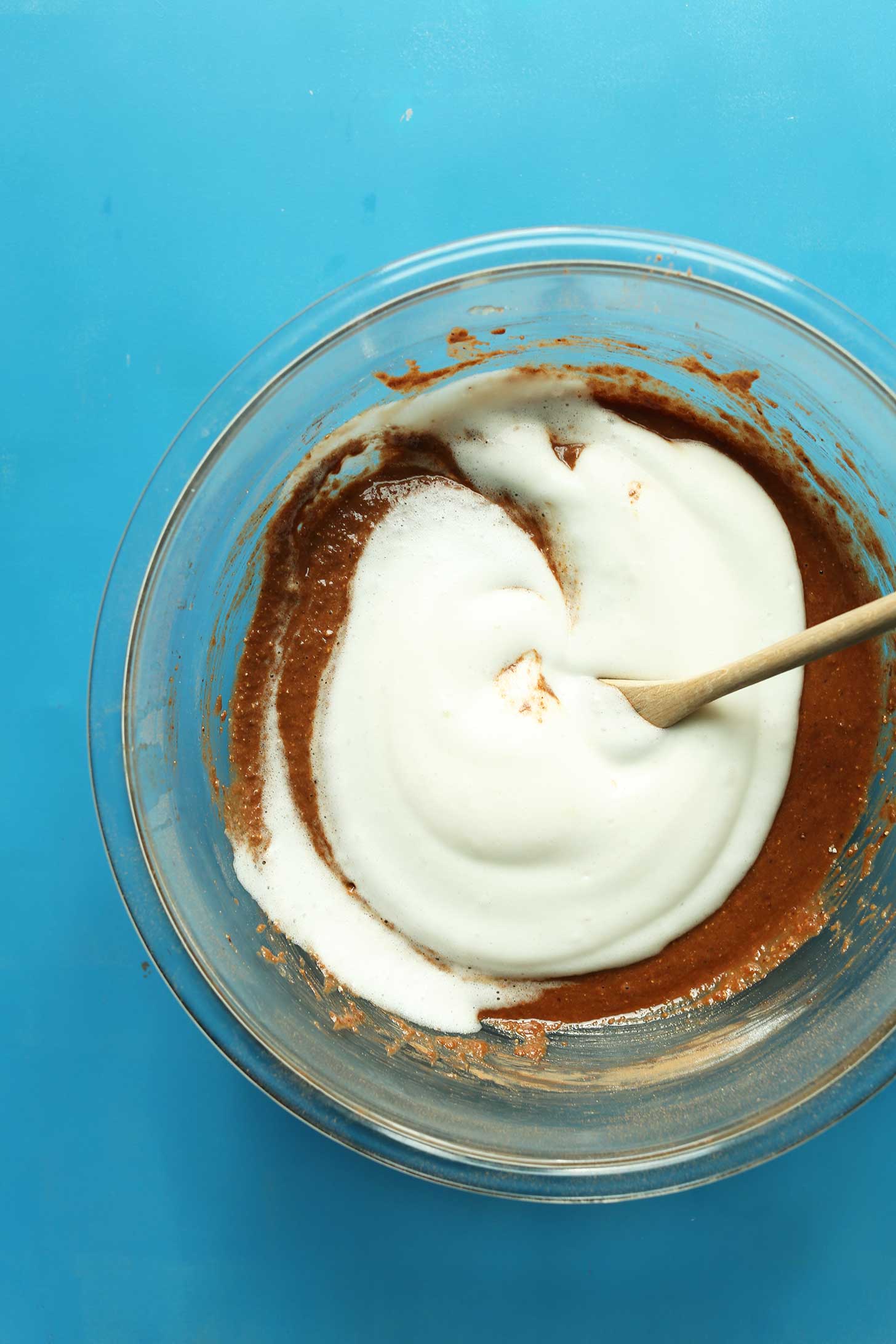 Stirring aquafaba into brownie batter as a delicious egg-free substitute
