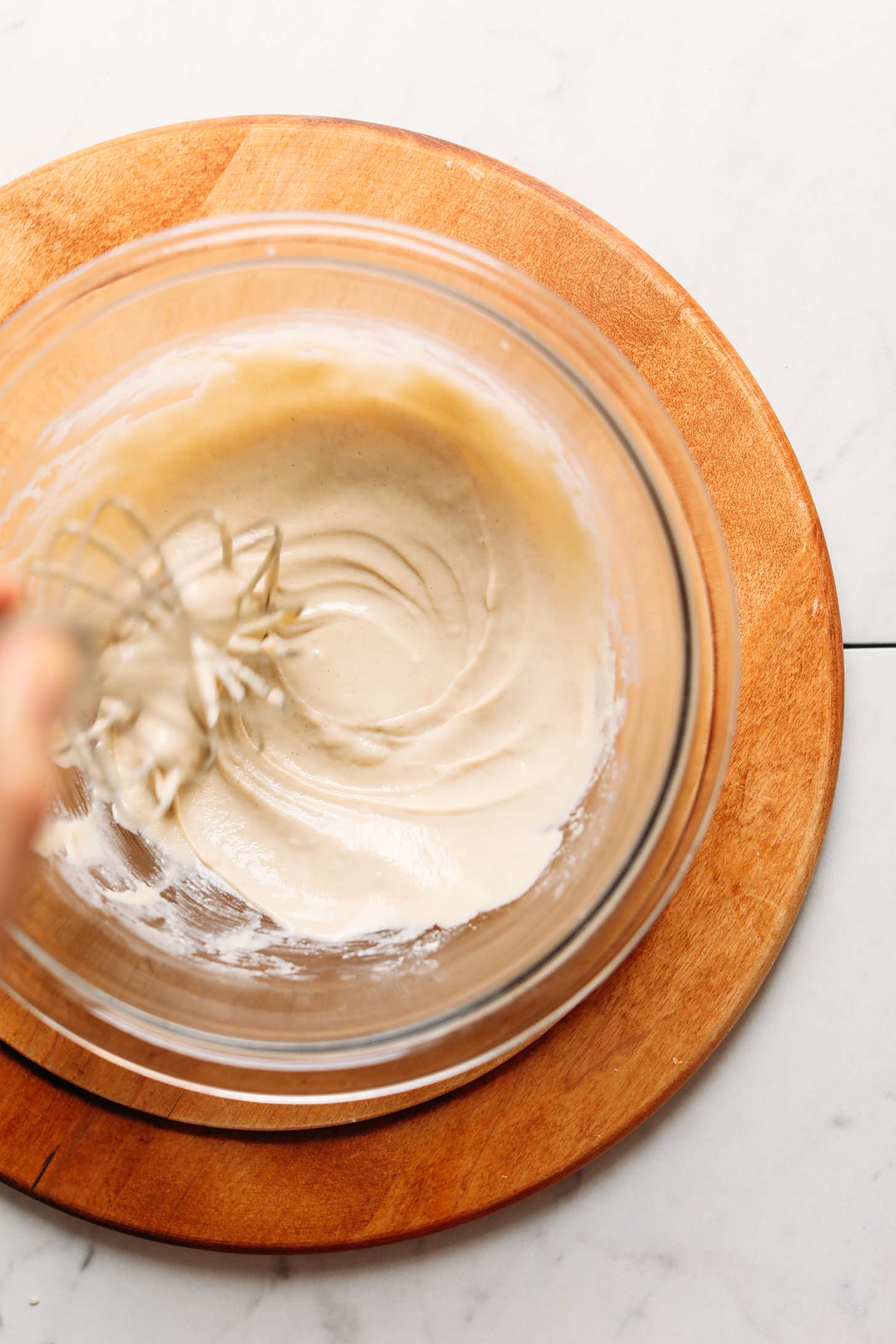 Whisking together ingredients for homemade Tahini Dressing