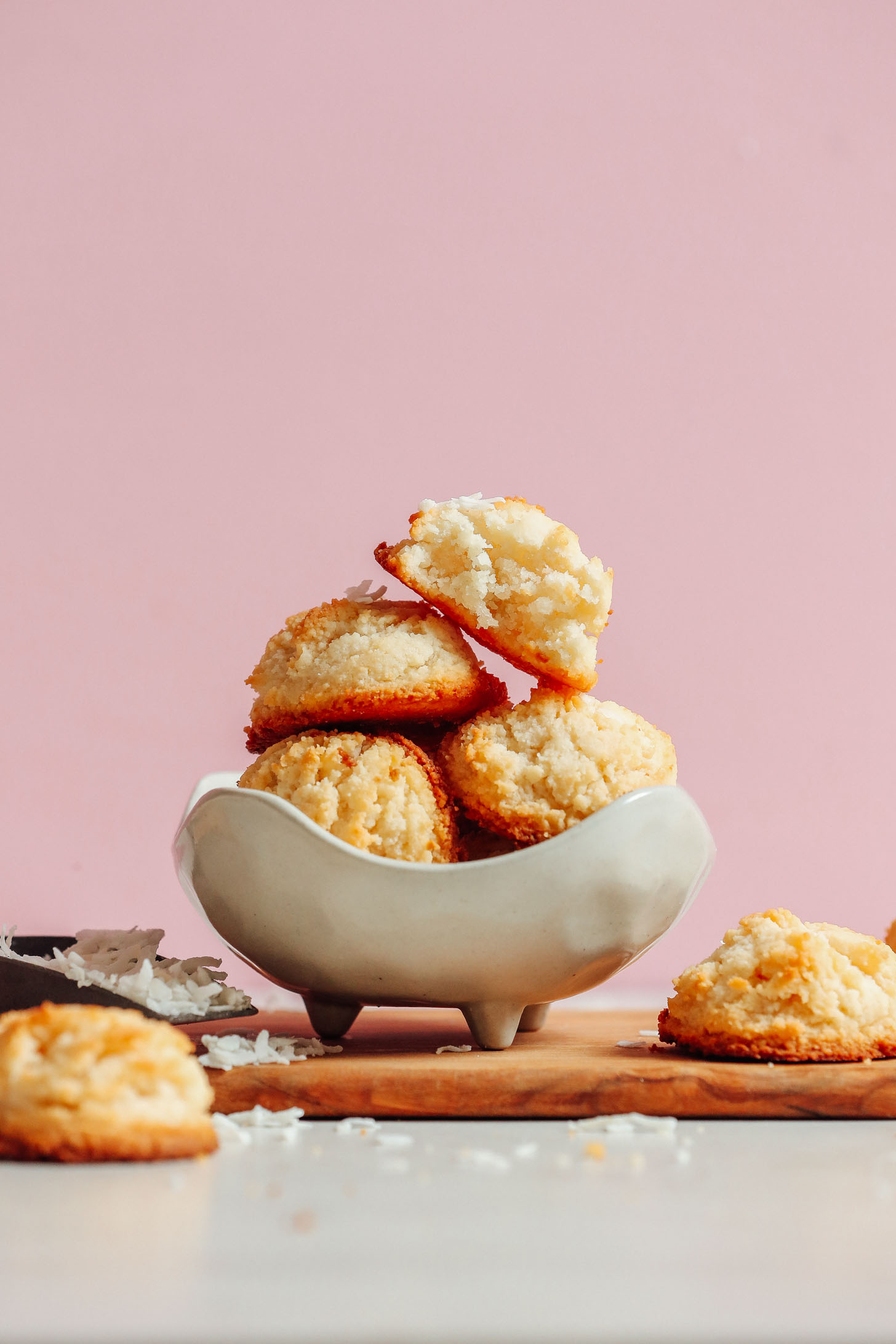 Bowl of stacked Vegan Coconut Snowball Cookies for a delicious gluten-free dessert