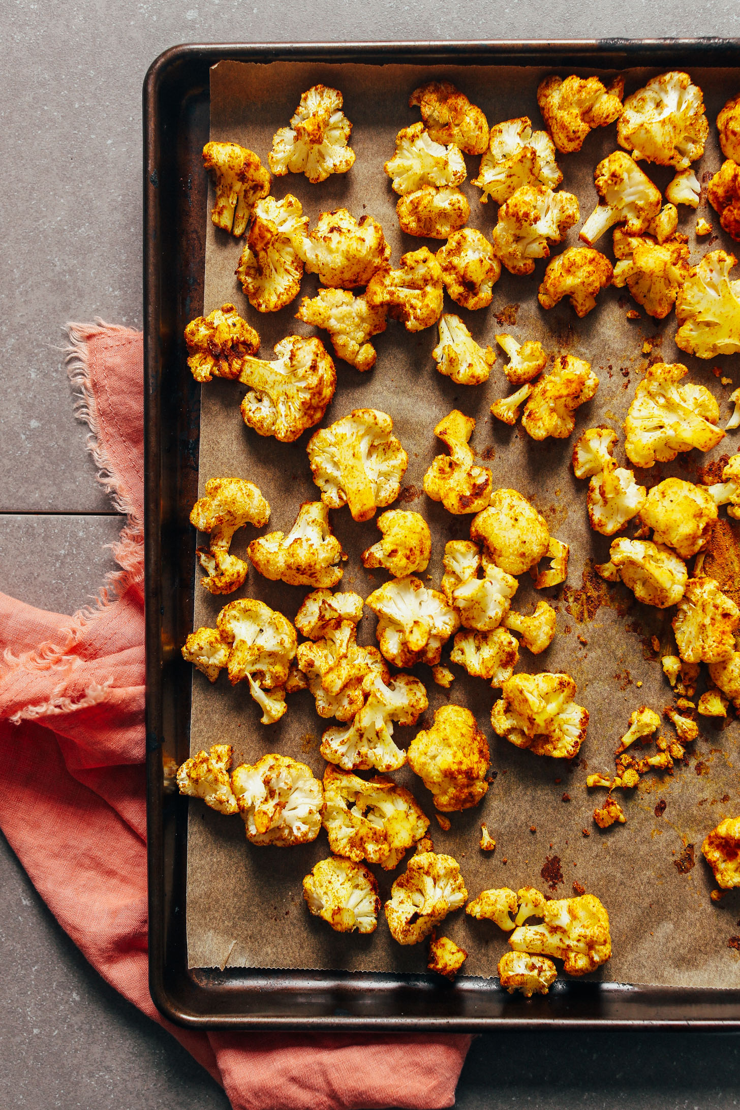 Baking sheet filled with insanely delicious Curry Roasted Cauliflower