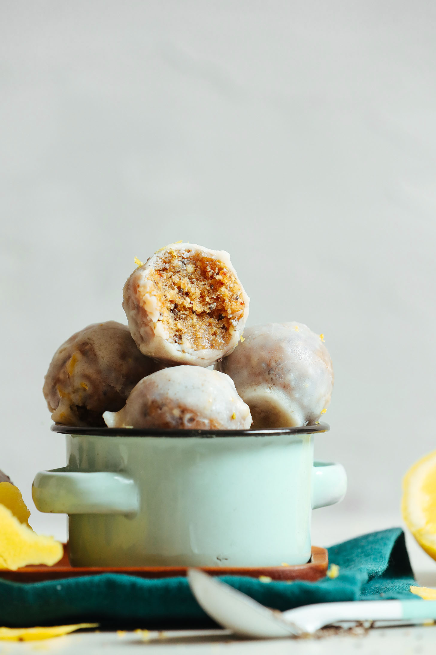 Small bowl filled with gluten-free Vegan Lemon Poppy Seed Donut Holes
