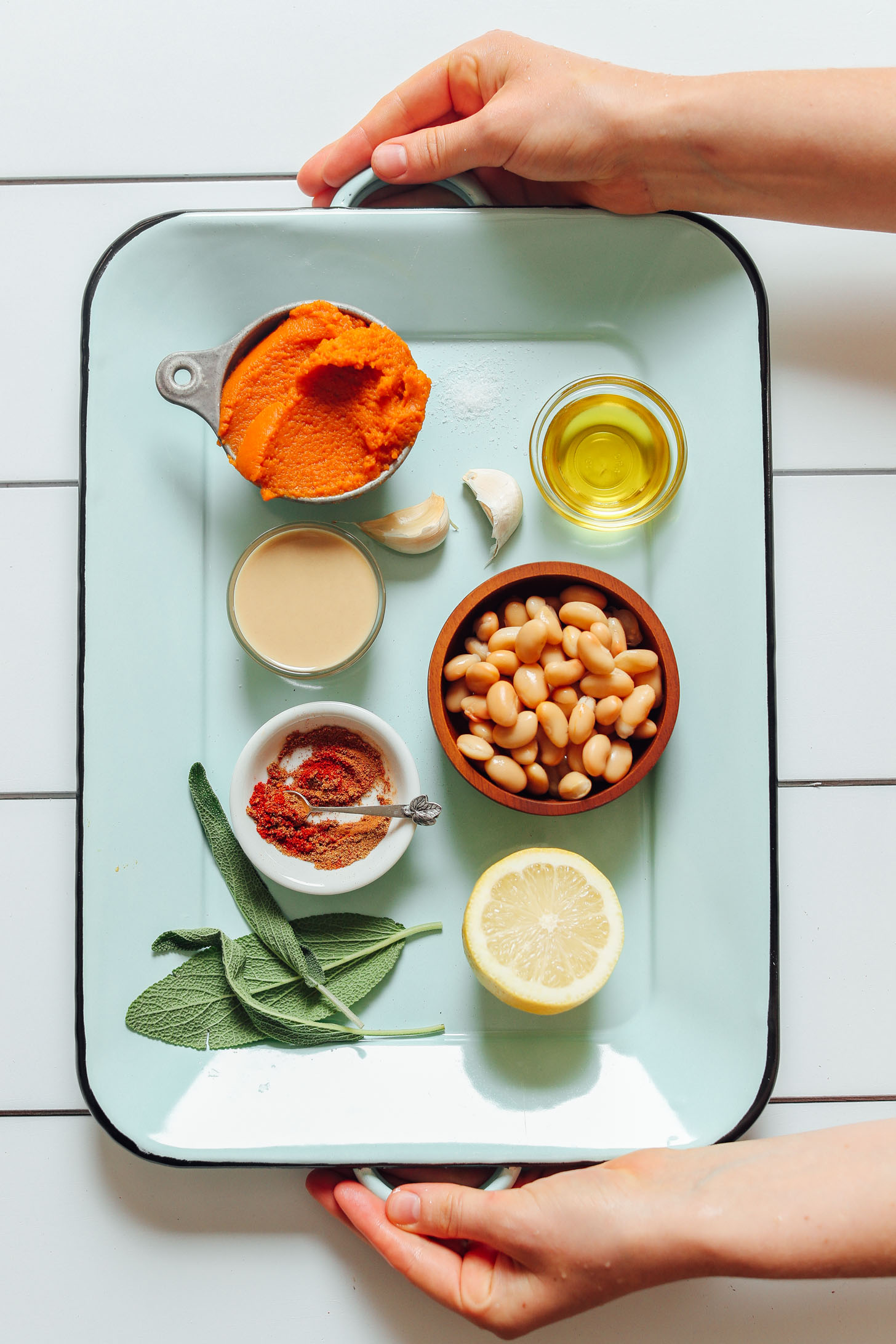 Tray filled with ingredients for making White Bean Pumpkin Hummus with Crispy Sage