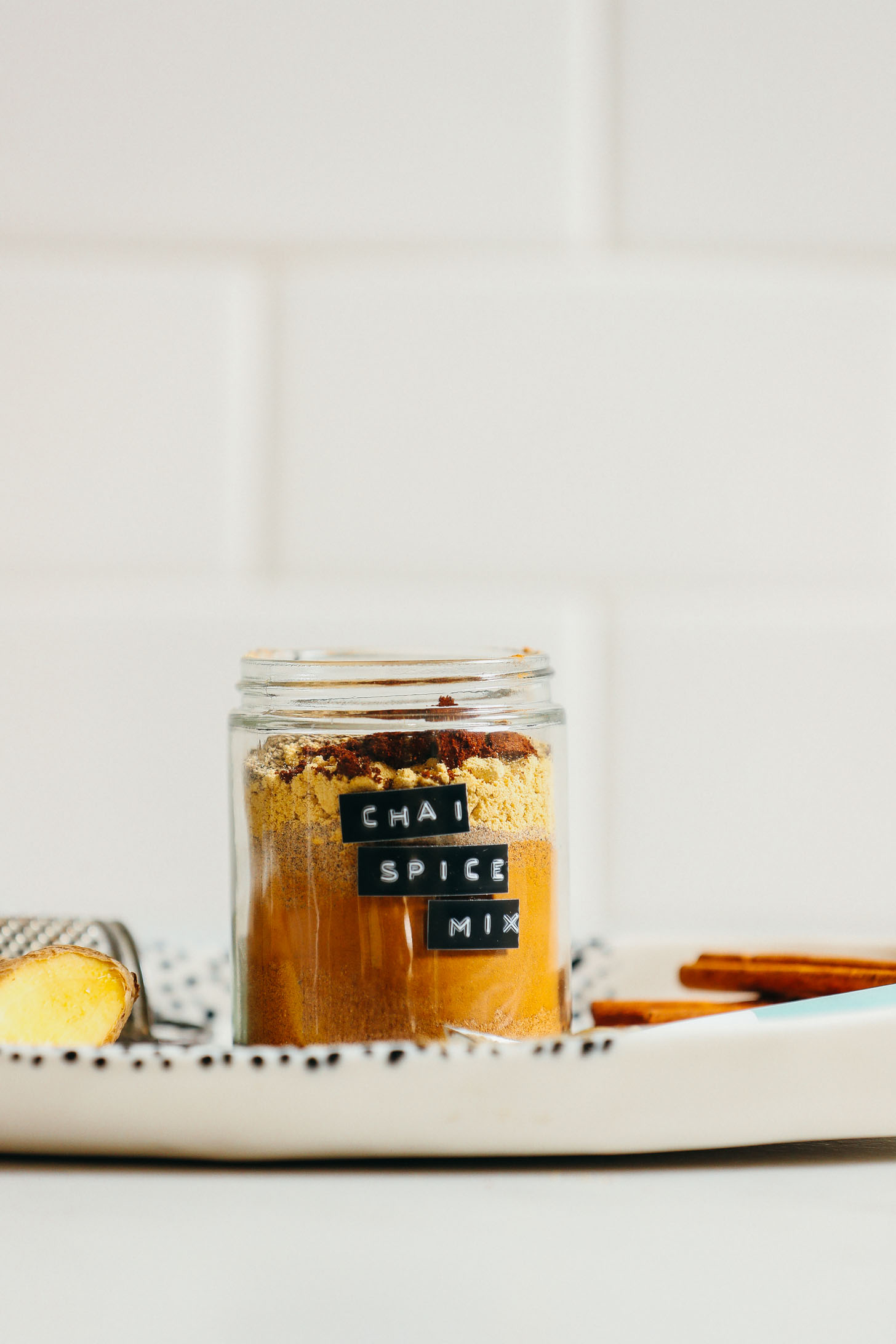 Close up shot of a beautifully layered jar of Chai Spice Mix