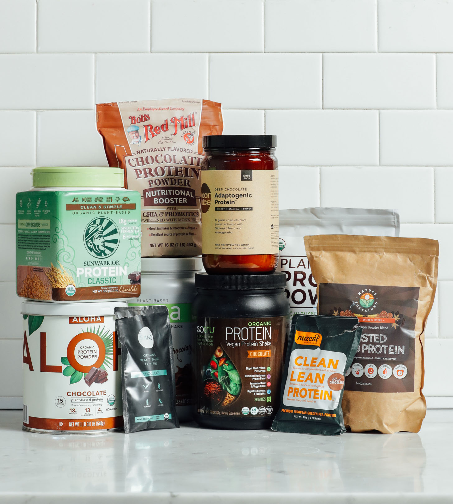 Collection of vegan chocolate protein powders for our unbiased review