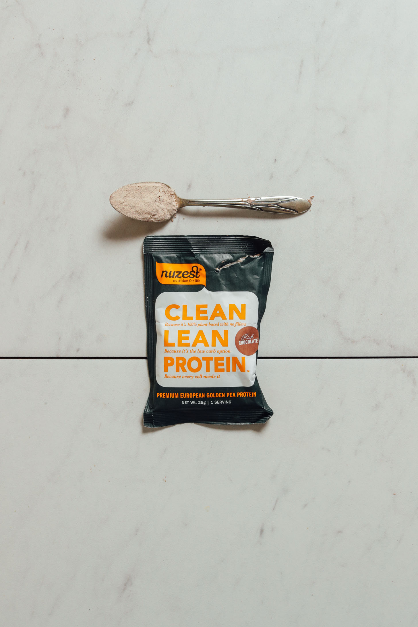 Pouch of Nuzest Chocolate Protein Powder for our vegan protein powder review