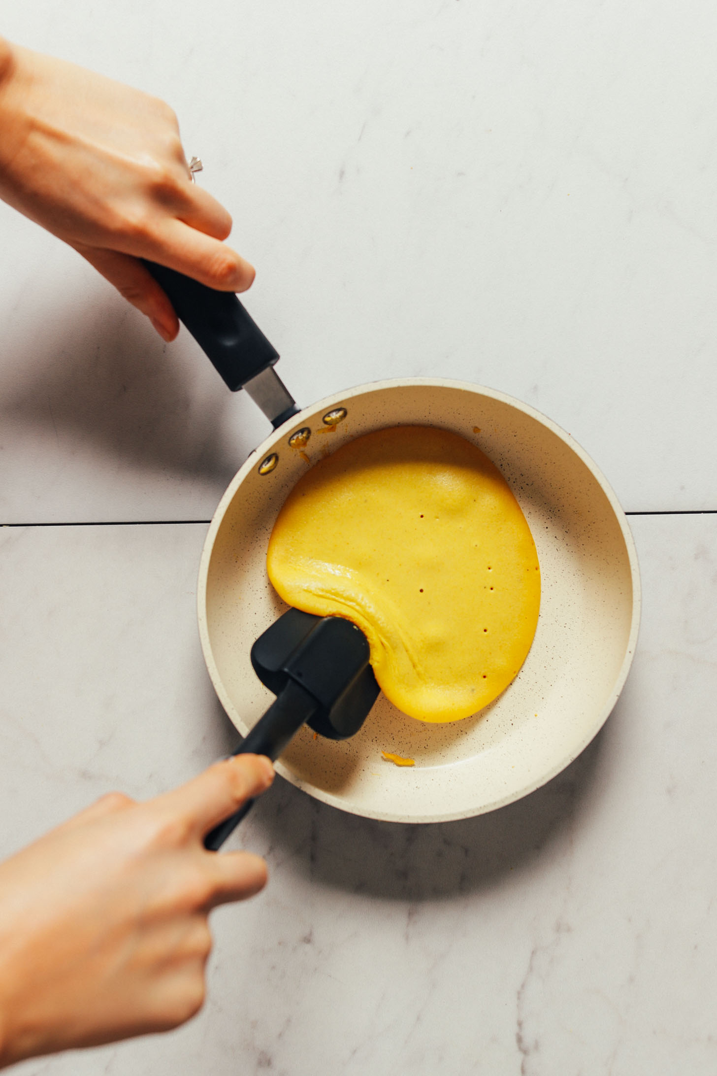 Using a non-toxic non-stick pan to cook our vegan scrambled egg recipe