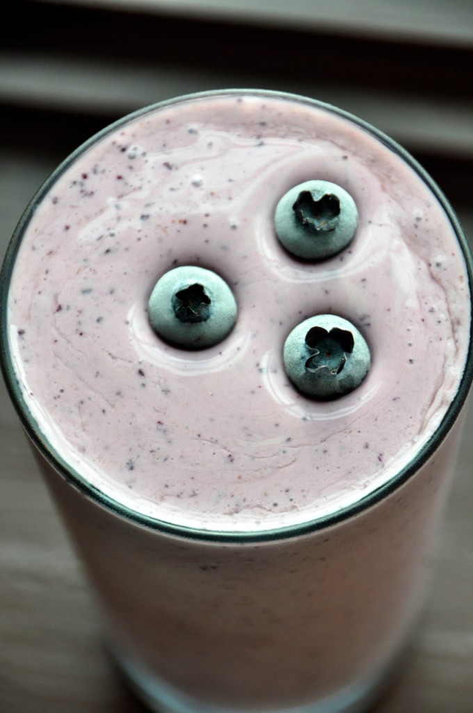 Top down shot of a glass of our Blueberry Maple Protein Shake recipe