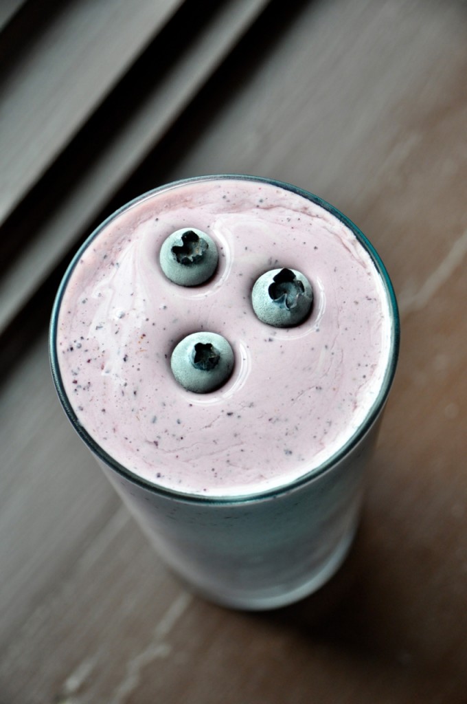 Top down shot of a Blueberry Maple Protein Shake with three blueberries on top