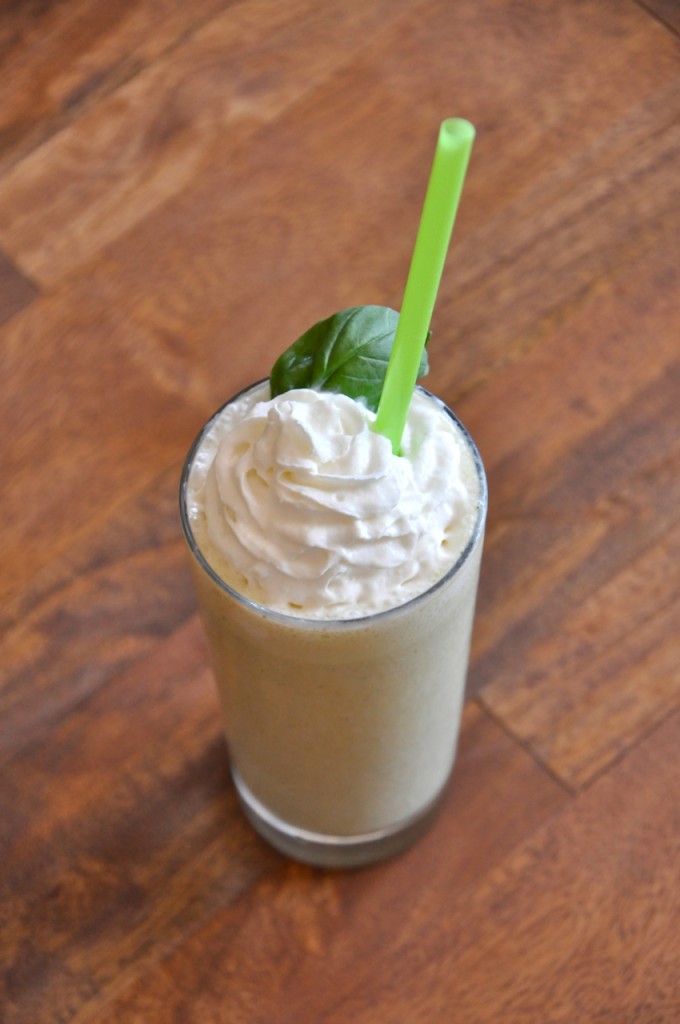 Tall glass filled with our Peanut Butter and Basil Milkshake recipe