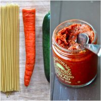 Spaghetti noodles, carrot, zucchini, and pesto for making a simple pasta dish