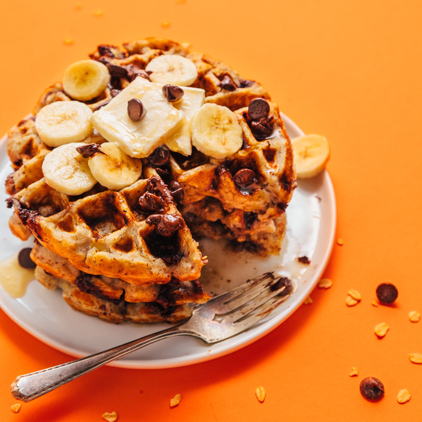 Chocolate Chip Banana Bread Waffles topped with sliced bananas and chocolate chips