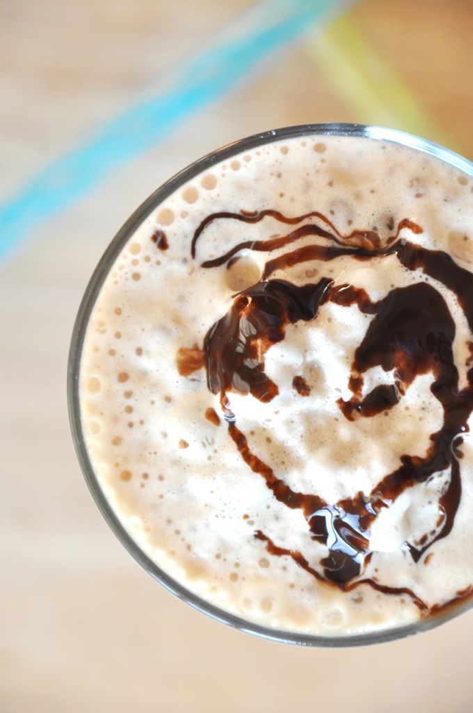 Close up shot of the whipped cream and chocolate sauce atop a homemade Cold Brew Mocha Frappe