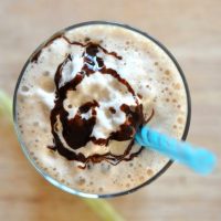 Top down shot of a Cold Brew Mocha Frappe topped with chocolate syrup