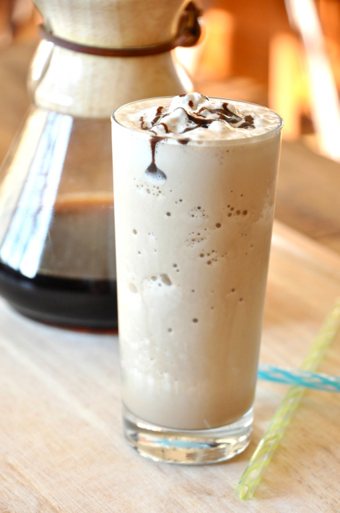 Tall glass of our Cold Brew Mocha Frappe recipe topped with whipped cream and chocolate sauce