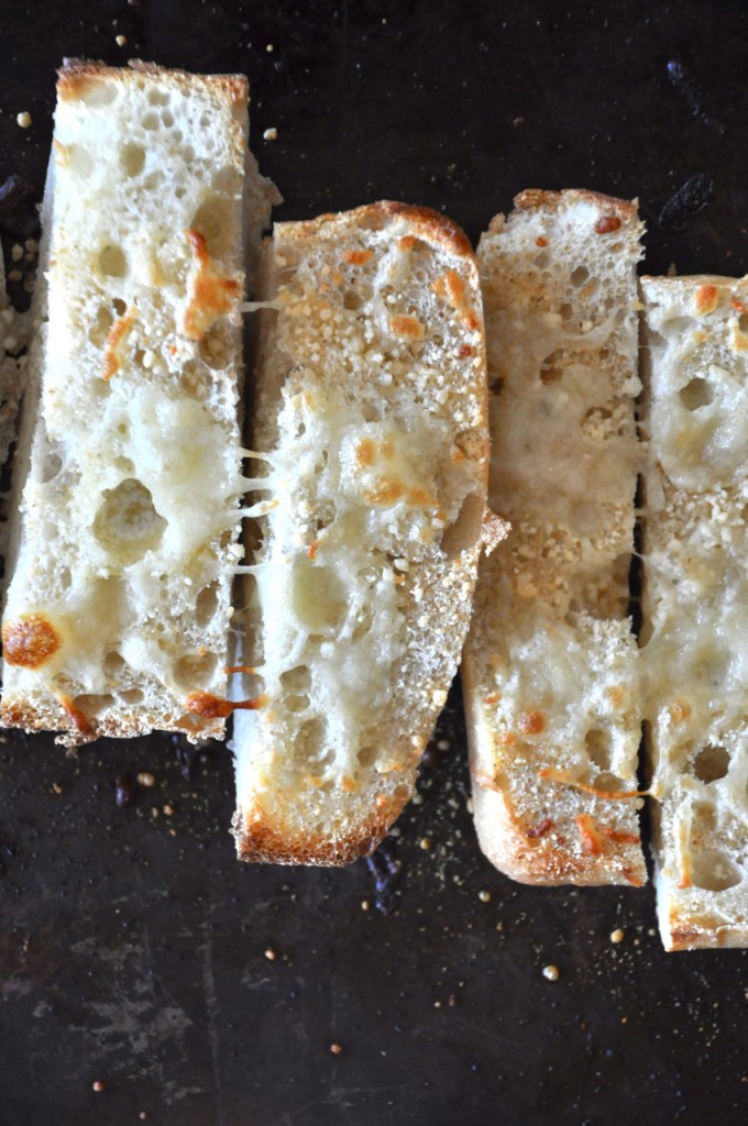 Baking sheet with slices of our Cheesy Garlic Ciabatta bread recipe