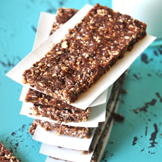 Stack of No Bake Cookie Bars with pieces of paper between them